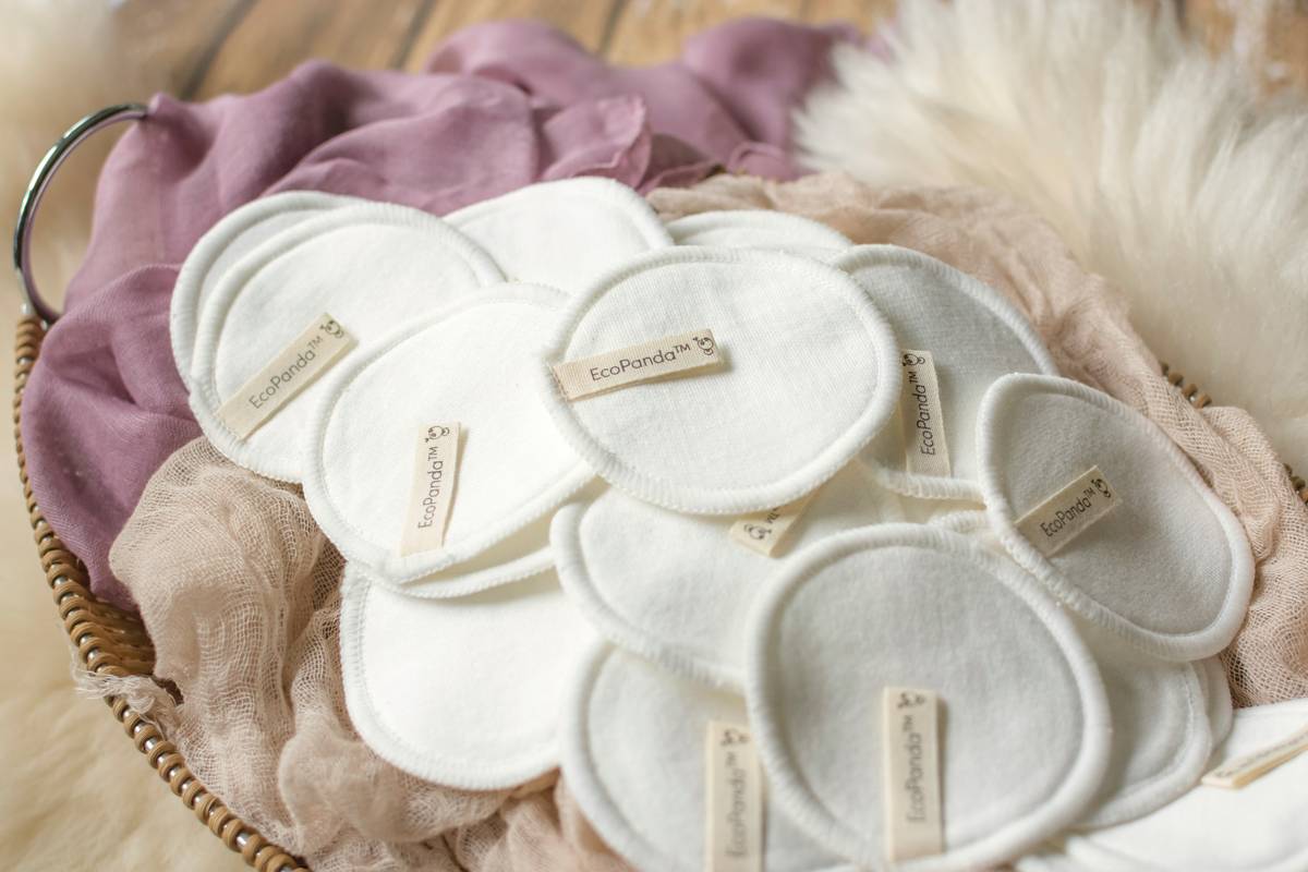 Homemade organic body wrap on bamboo tray surrounded by reusable glass jars demonstrating Waste Reduction